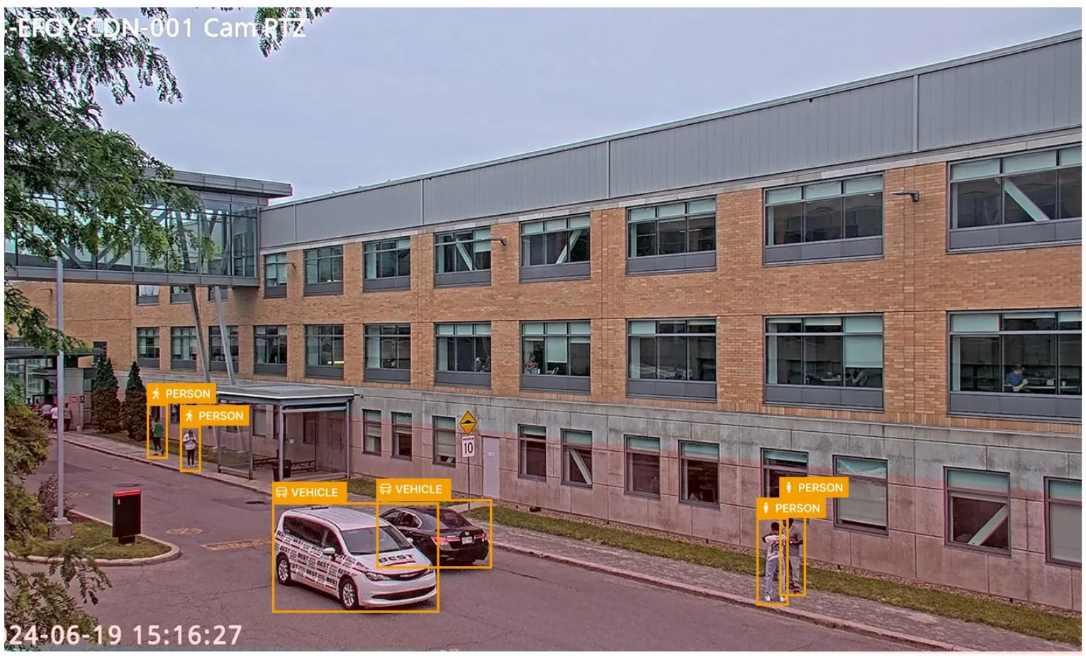 Detections in the live view — person and vehicle, each with a confidence score.